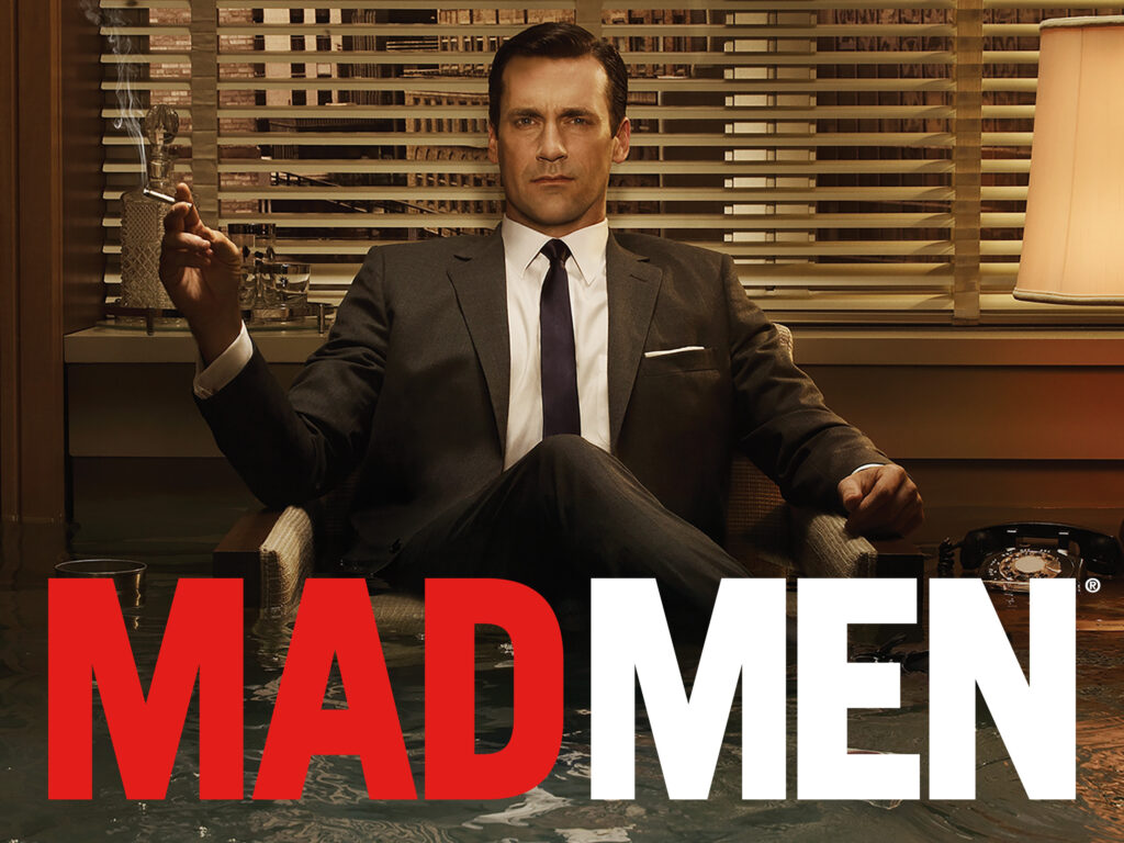 Don Draper de la série Mad Men, représentant le modèle traditionnel des agences de publicité